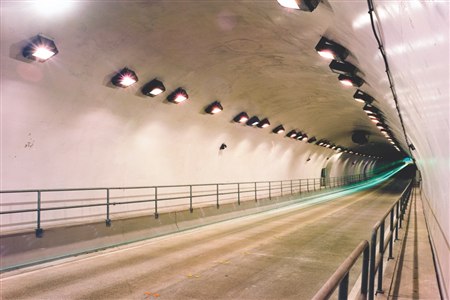 Interior of the Addison Airport Toll Tunnel showing resilient roadway lighting